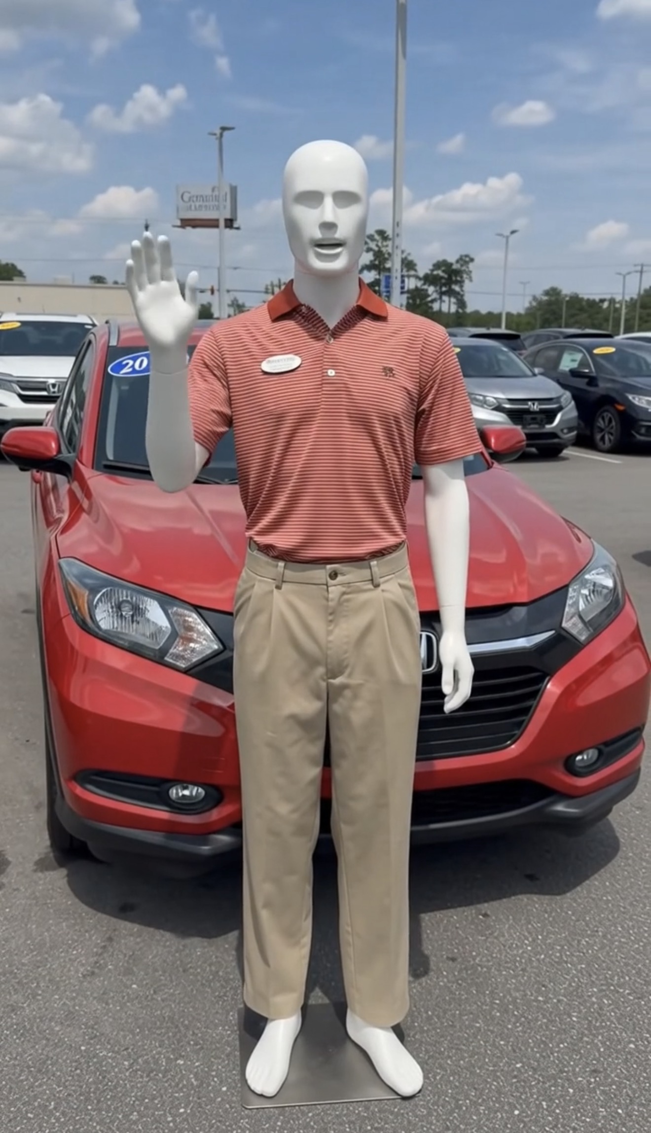 Manny Quinn standing with a Honda at Gerald Jones Honda in Augusta Georgia